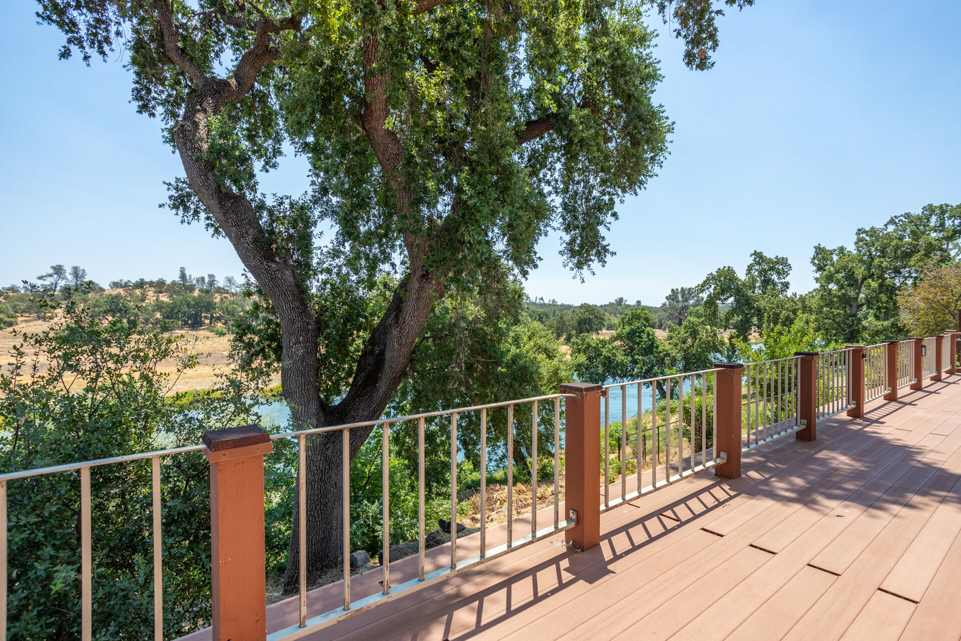 15560 China Rapids Drive Red Bluff, CA 96080 - Photo 37 of 43 a view of a balcony with wooden floor and fence