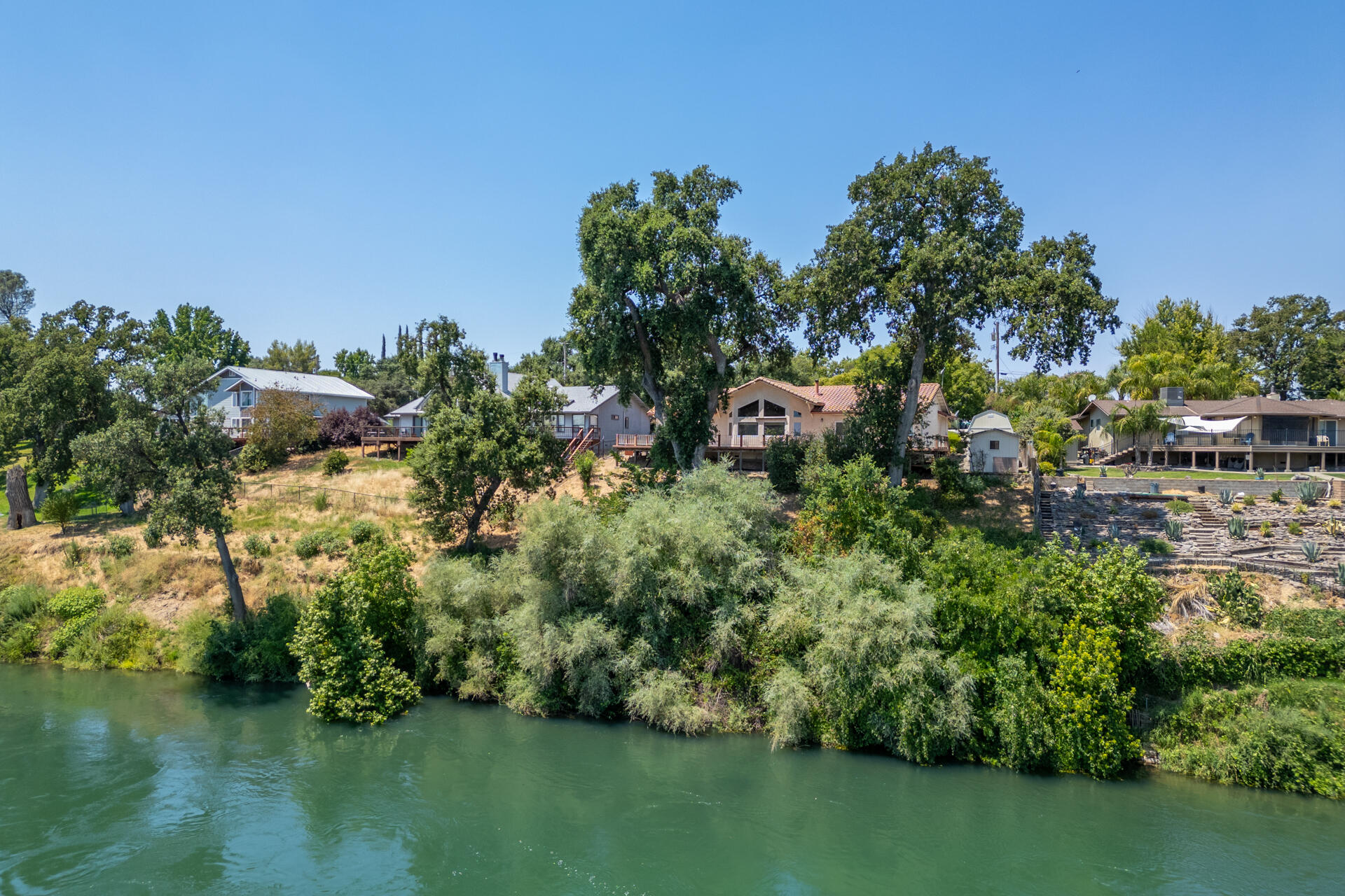 15560 China Rapids Drive Red Bluff, CA 96080 - Photo 4 of 43 a view of a lake with houses