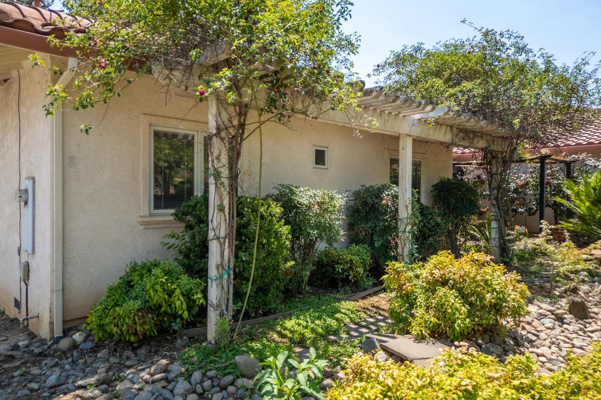 15560 China Rapids Drive Red Bluff, CA 96080 - Photo 9 of 43 a front view of a house with a yard