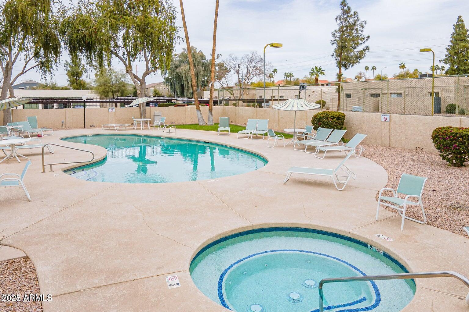 712 South Lebanon Lane Tempe, AZ 85288 - Photo 14 of 35 a view of a swimming pool with a patio