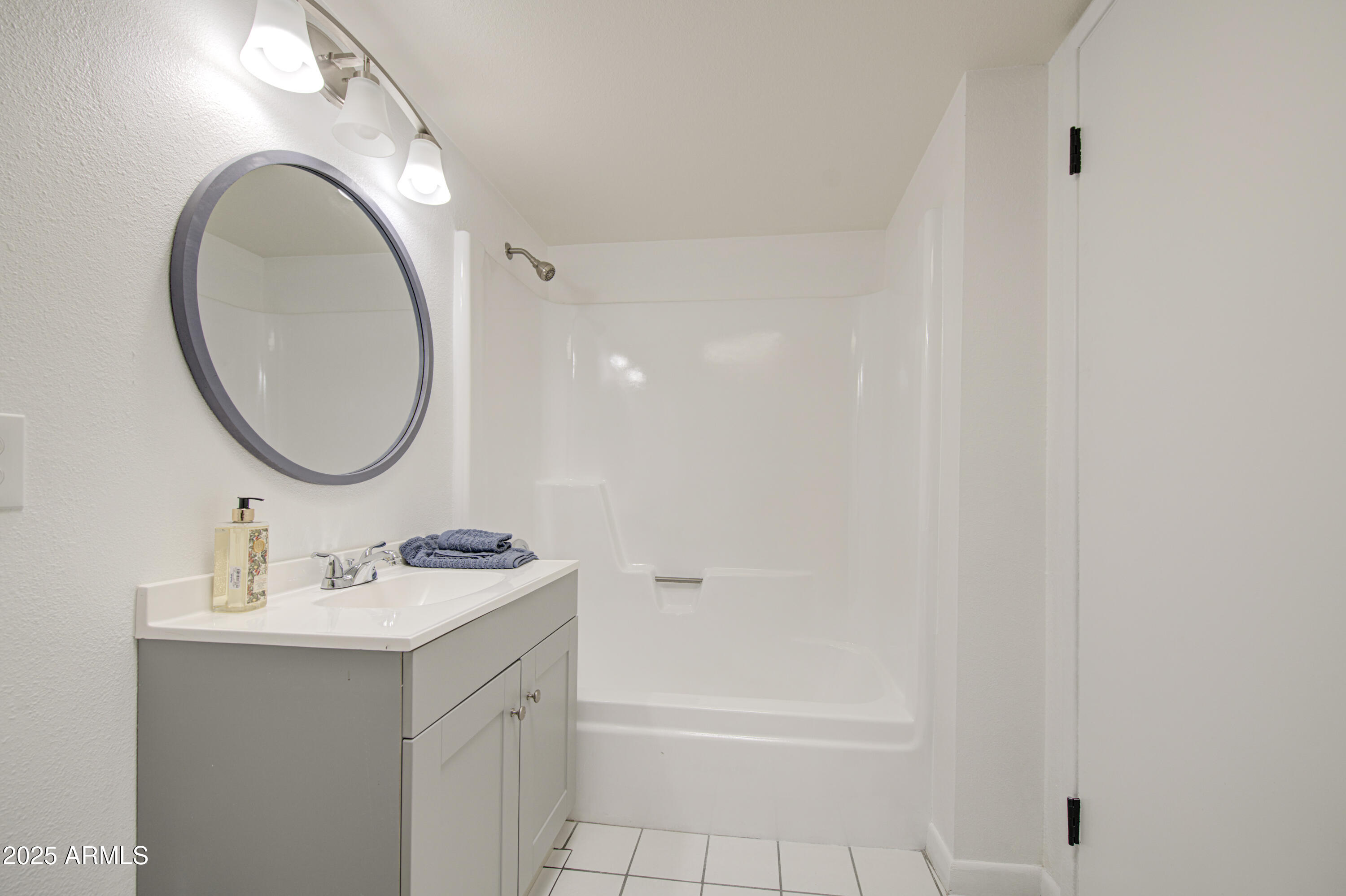 712 South Lebanon Lane Tempe, AZ 85288 - Photo 20 of 35 a bathroom with a sink and a mirror