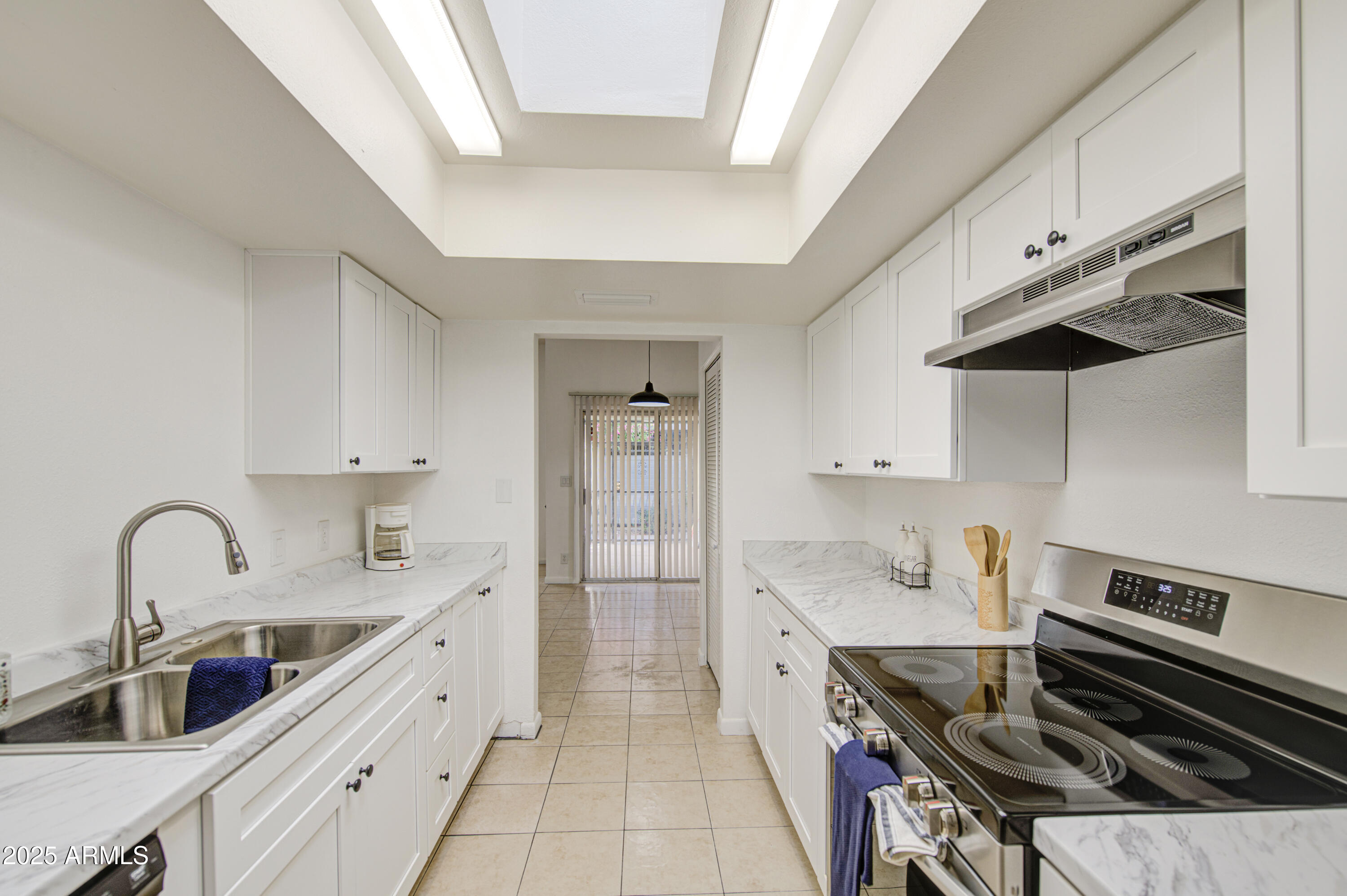 712 South Lebanon Lane Tempe, AZ 85288 - Photo 28 of 35 a kitchen with a sink stainless steel appliances and cabinets