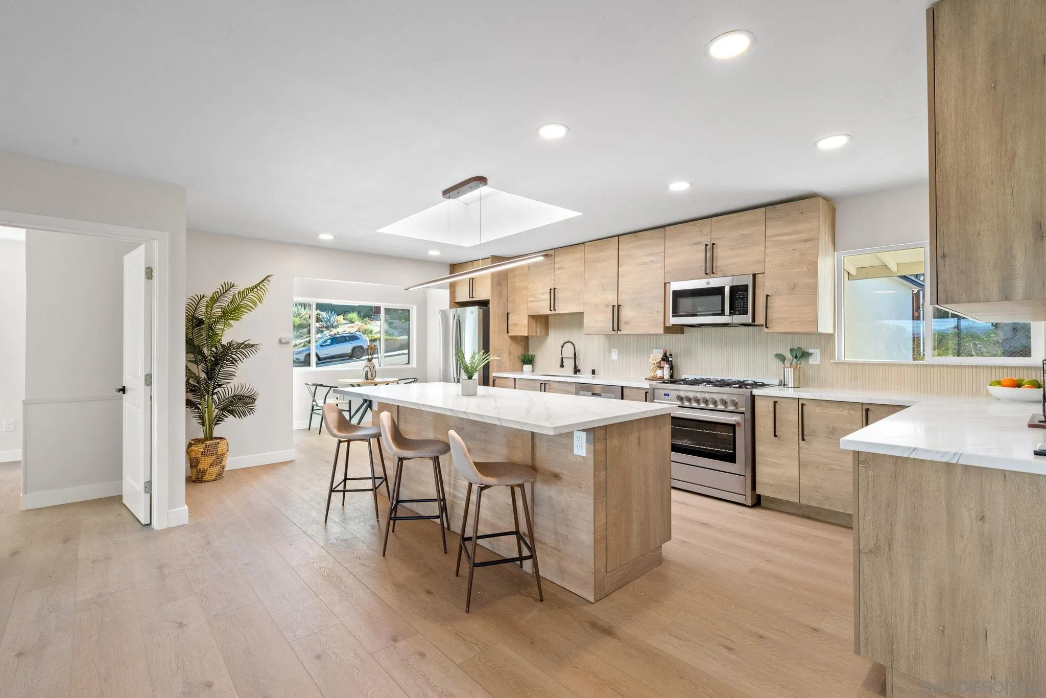 10104 Cristobal Drive Spring Valley, CA 91977 - Photo 14 of 56 a large kitchen with a table and chairs in it