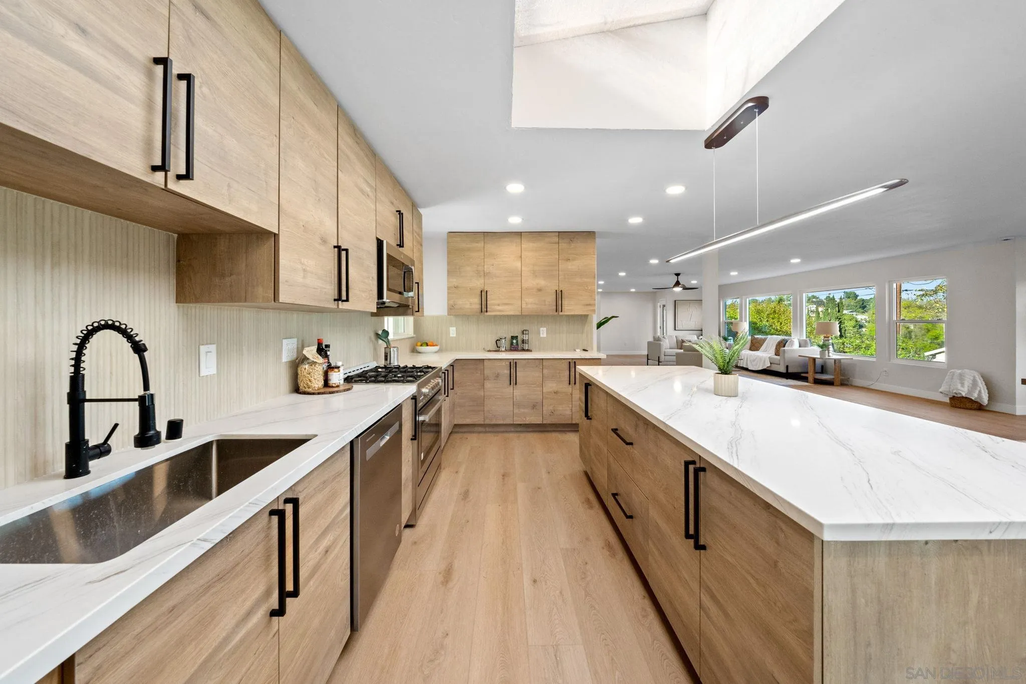10104 Cristobal Drive Spring Valley, CA 91977 - Photo 19 of 56 a large kitchen with stainless steel appliances lots of counter space sink and cabinets
