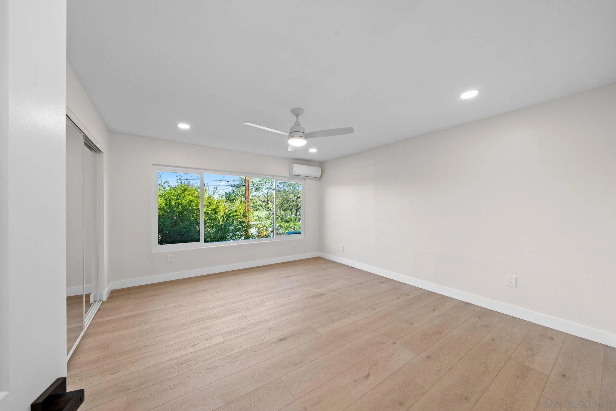 10104 Cristobal Drive Spring Valley, CA 91977 - Photo 31 of 56 wooden floor in an empty room with a window