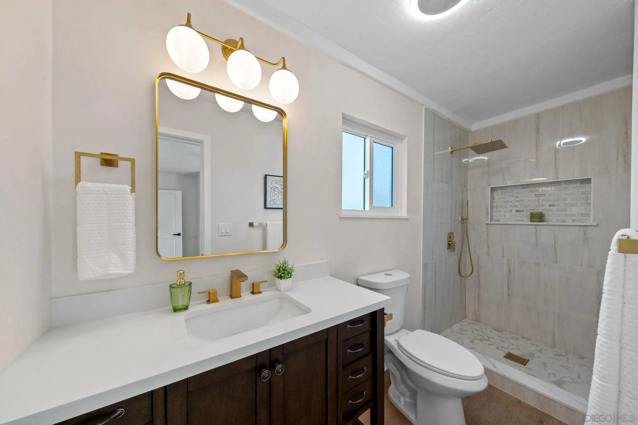 10104 Cristobal Drive Spring Valley, CA 91977 - Photo 36 of 56 a bathroom with a shower sink vanity mirror and toilet