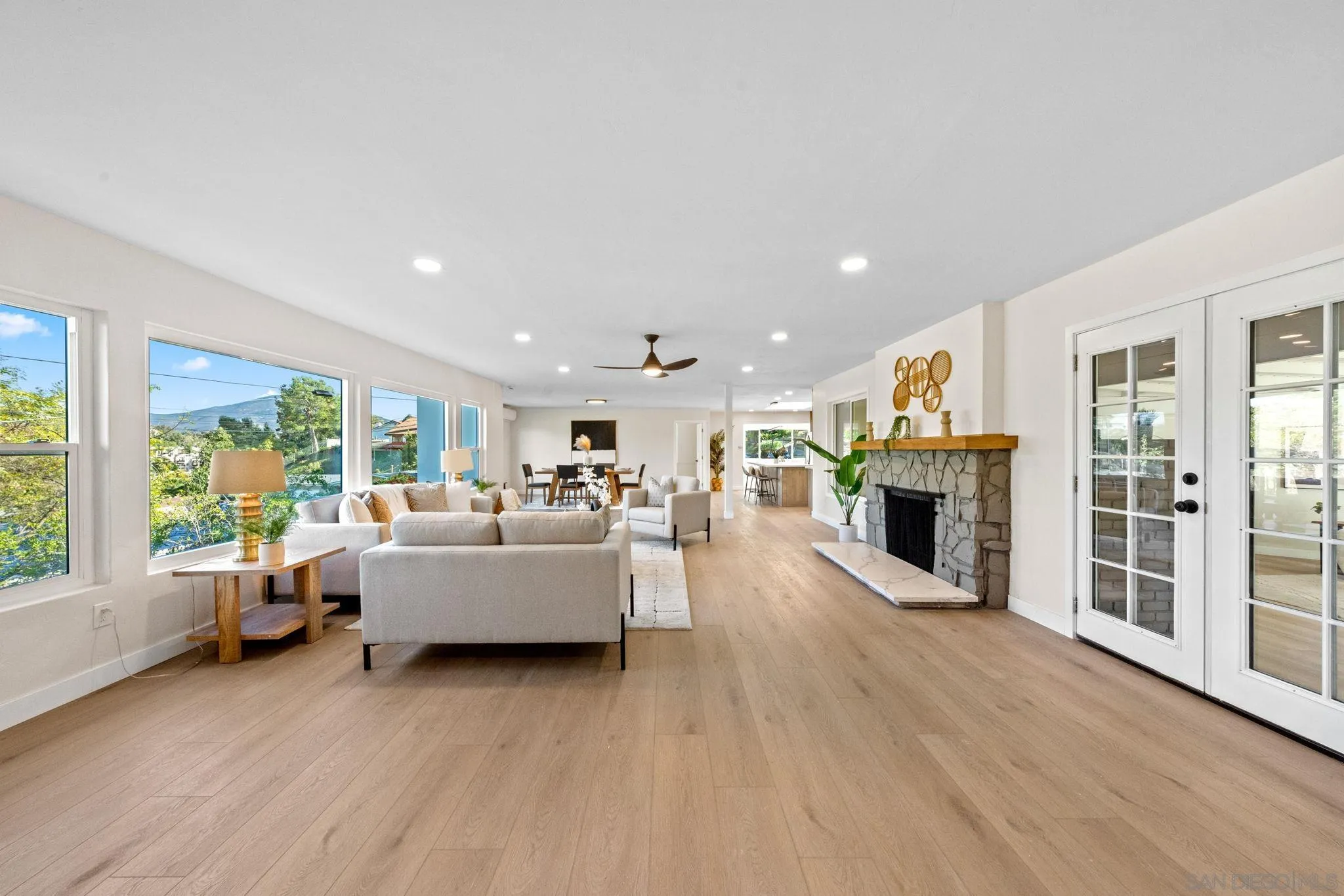10104 Cristobal Drive Spring Valley, CA 91977 - Photo 5 of 56 a living room with furniture a fireplace and a large window