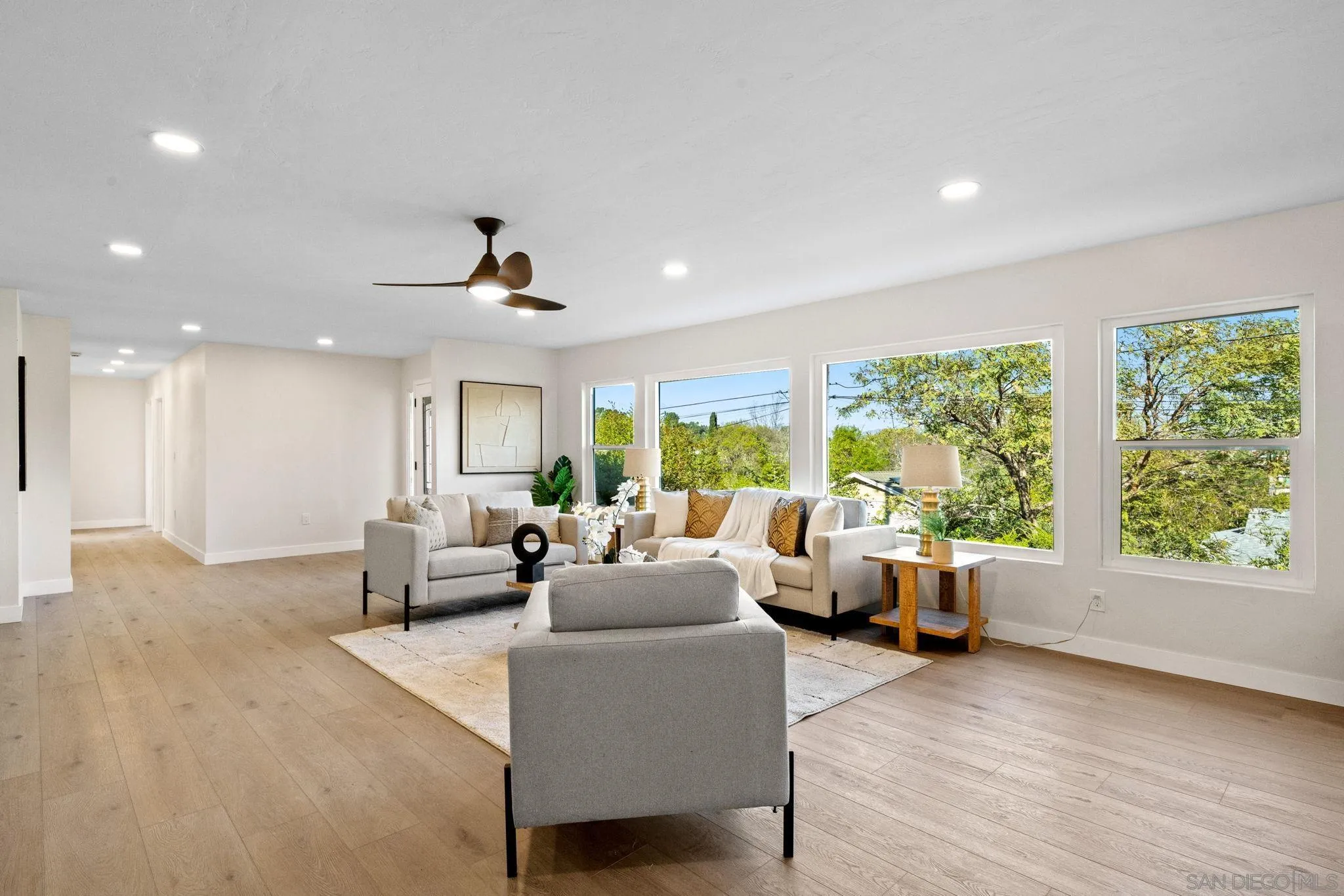 10104 Cristobal Drive Spring Valley, CA 91977 - Photo 8 of 56 a living room with furniture and large windows