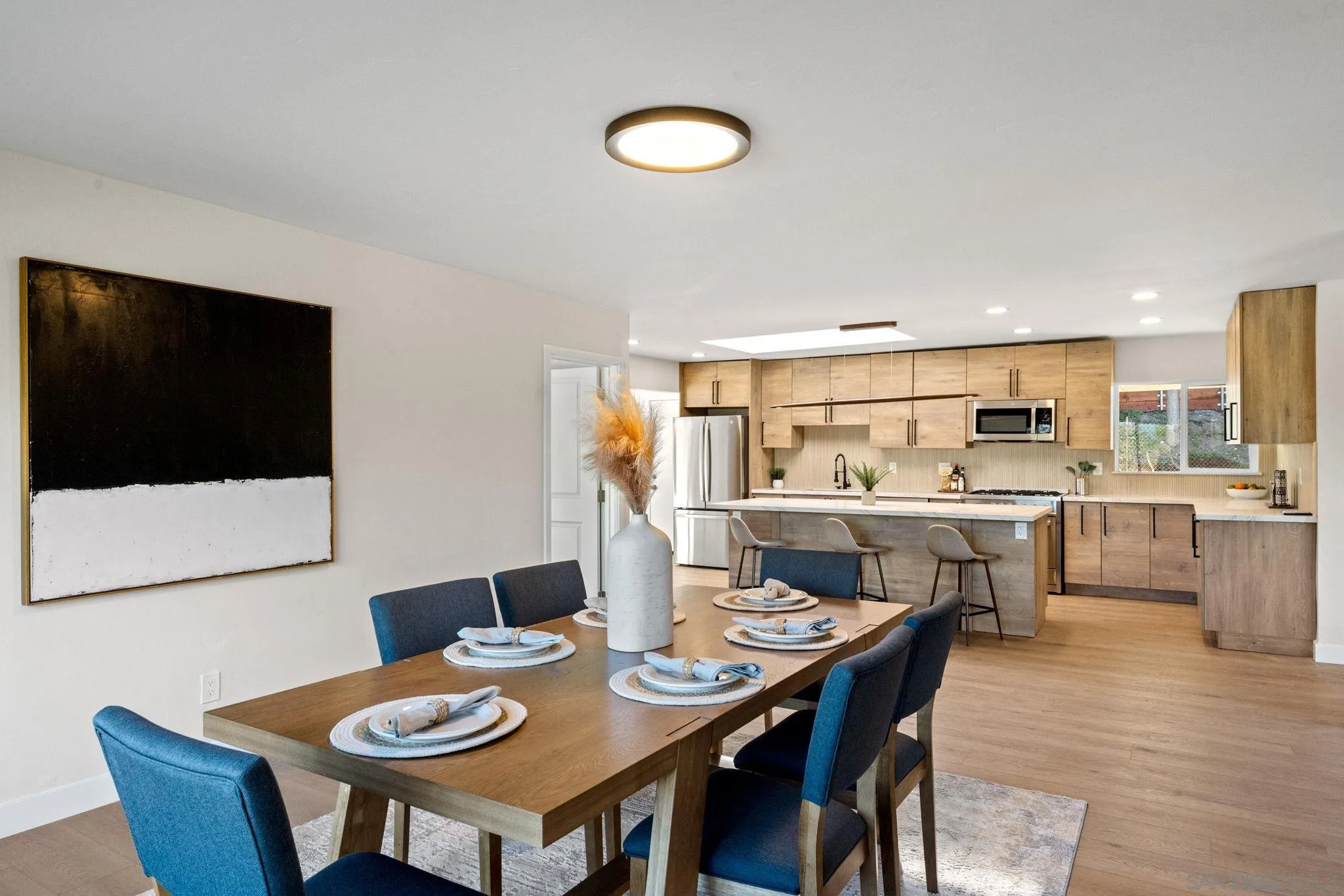 10104 Cristobal Drive Spring Valley, CA 91977 - Photo 10 of 56 a view of a dining room with furniture and wooden floor