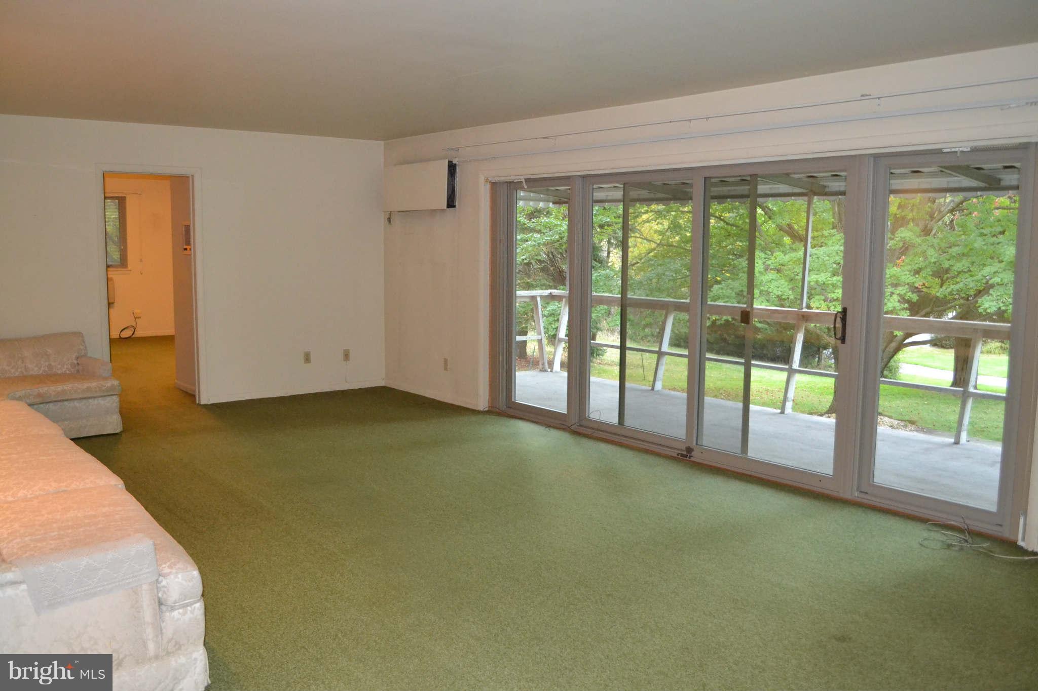 1904 Merrifields Drive Silver Spring, MD 20906 - Photo 4 of 16 Wall of sliding glass doors to deck