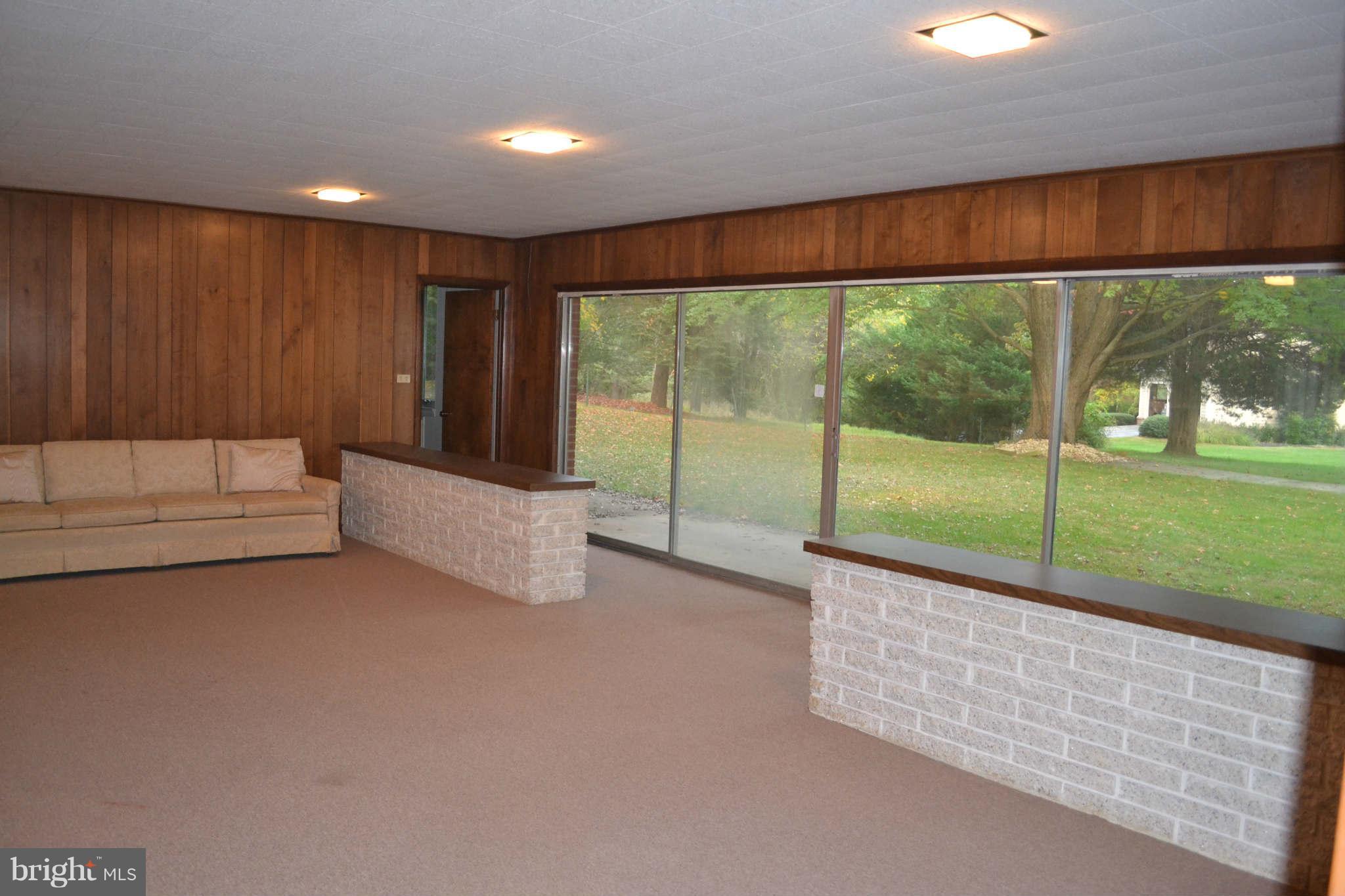 1904 Merrifields Drive Silver Spring, MD 20906 - Photo 9 of 16 Wall of glass doors lead to backyard -lower level