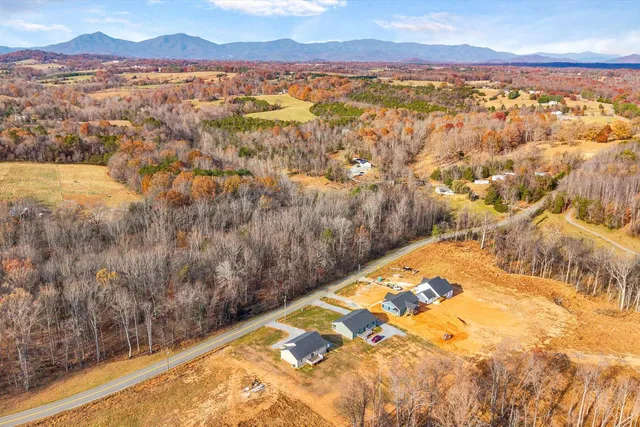 a view of house with yard