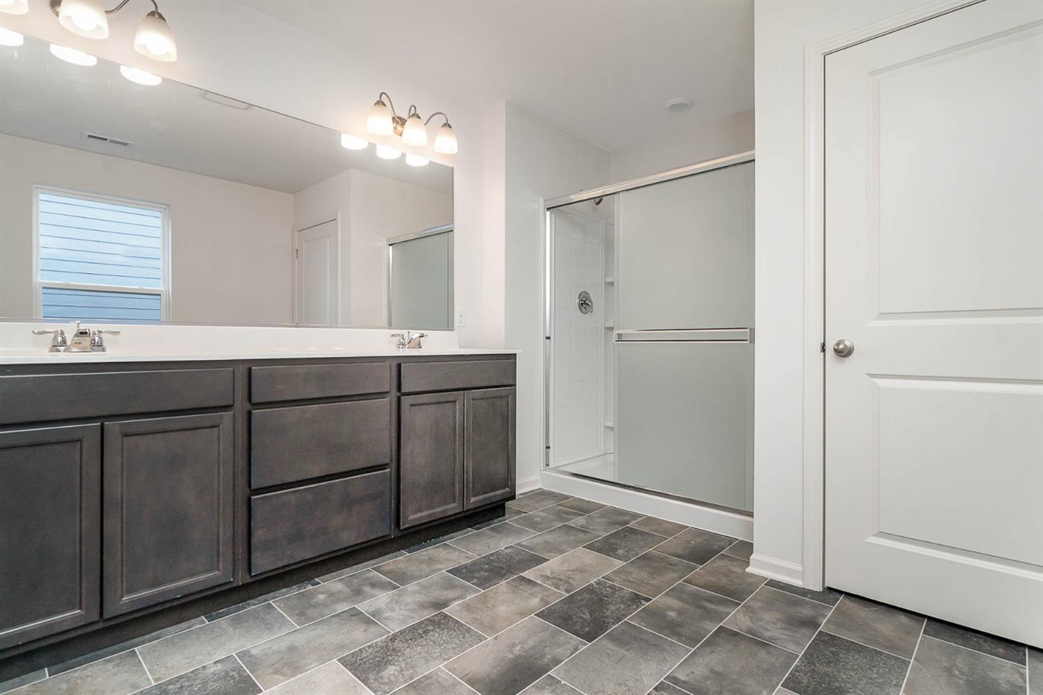 10354 Bryan Place Crown Point, IN 46307 - Photo 17 of 35 a bathroom with a sink and a mirror