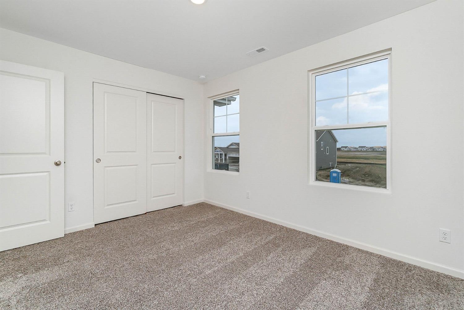 10354 Bryan Place Crown Point, IN 46307 - Photo 20 of 35 an empty room with windows and closet
