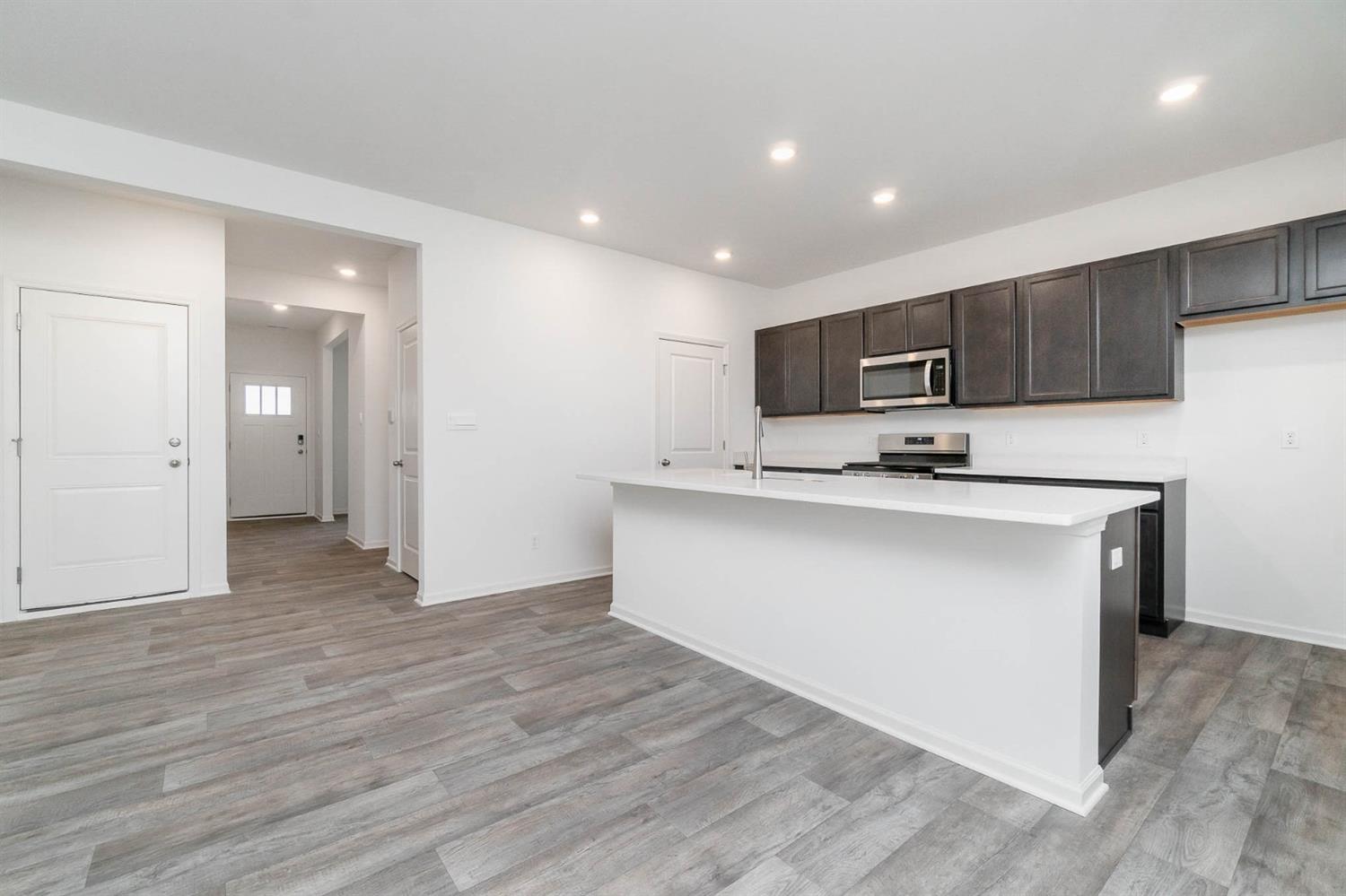 10354 Bryan Place Crown Point, IN 46307 - Photo 2 of 35 a kitchen with stainless steel appliances a refrigerator and a stove top oven