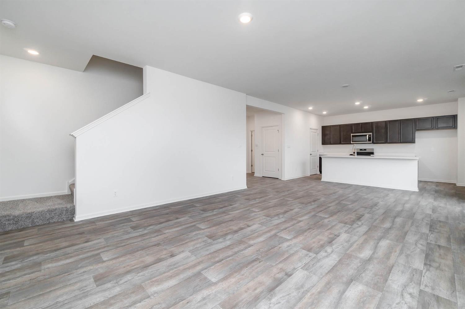 10354 Bryan Place Crown Point, IN 46307 - Photo 4 of 35 a view of a kitchen with a sink and a refrigerator