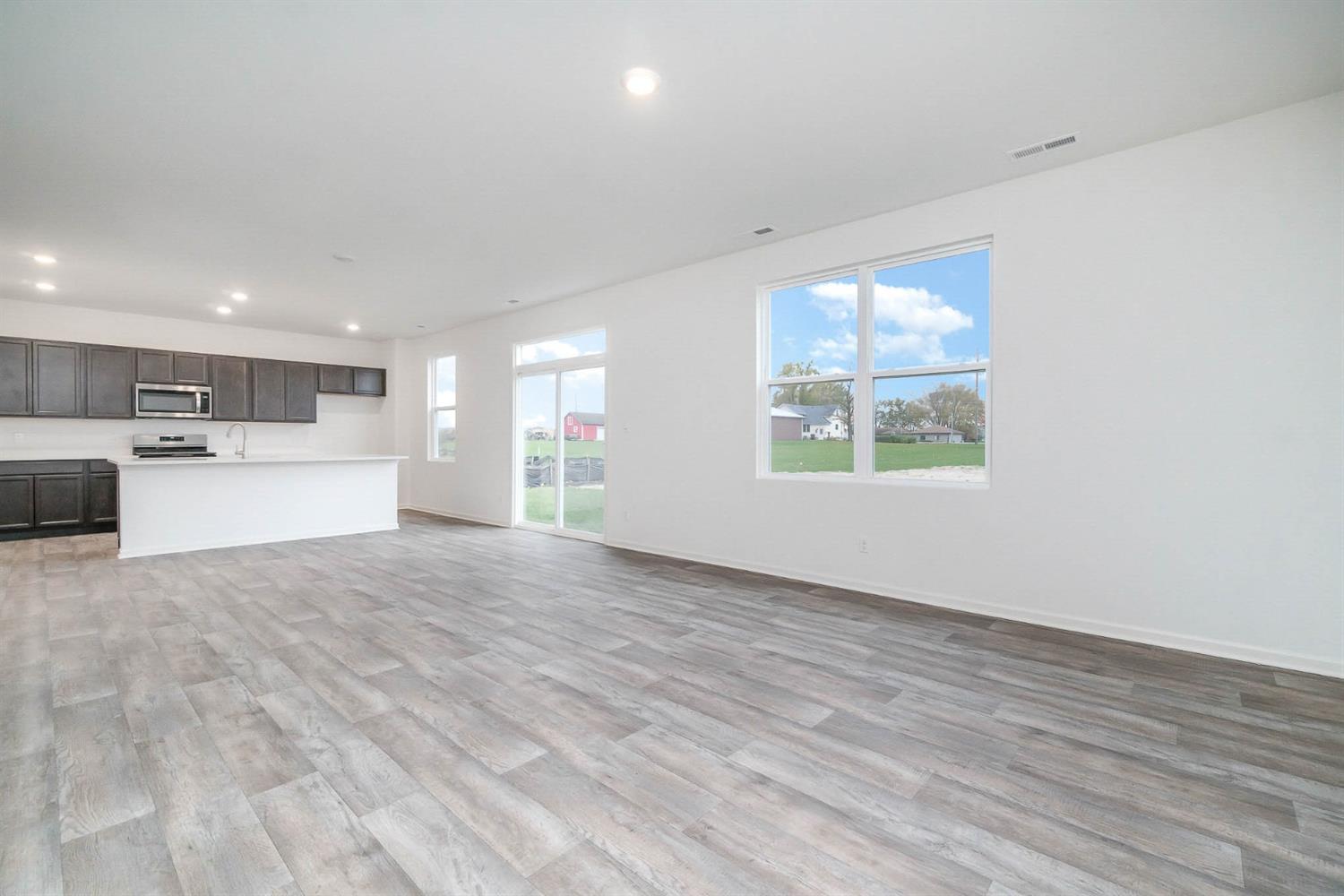 10354 Bryan Place Crown Point, IN 46307 - Photo 5 of 35 a view of an empty room with a window