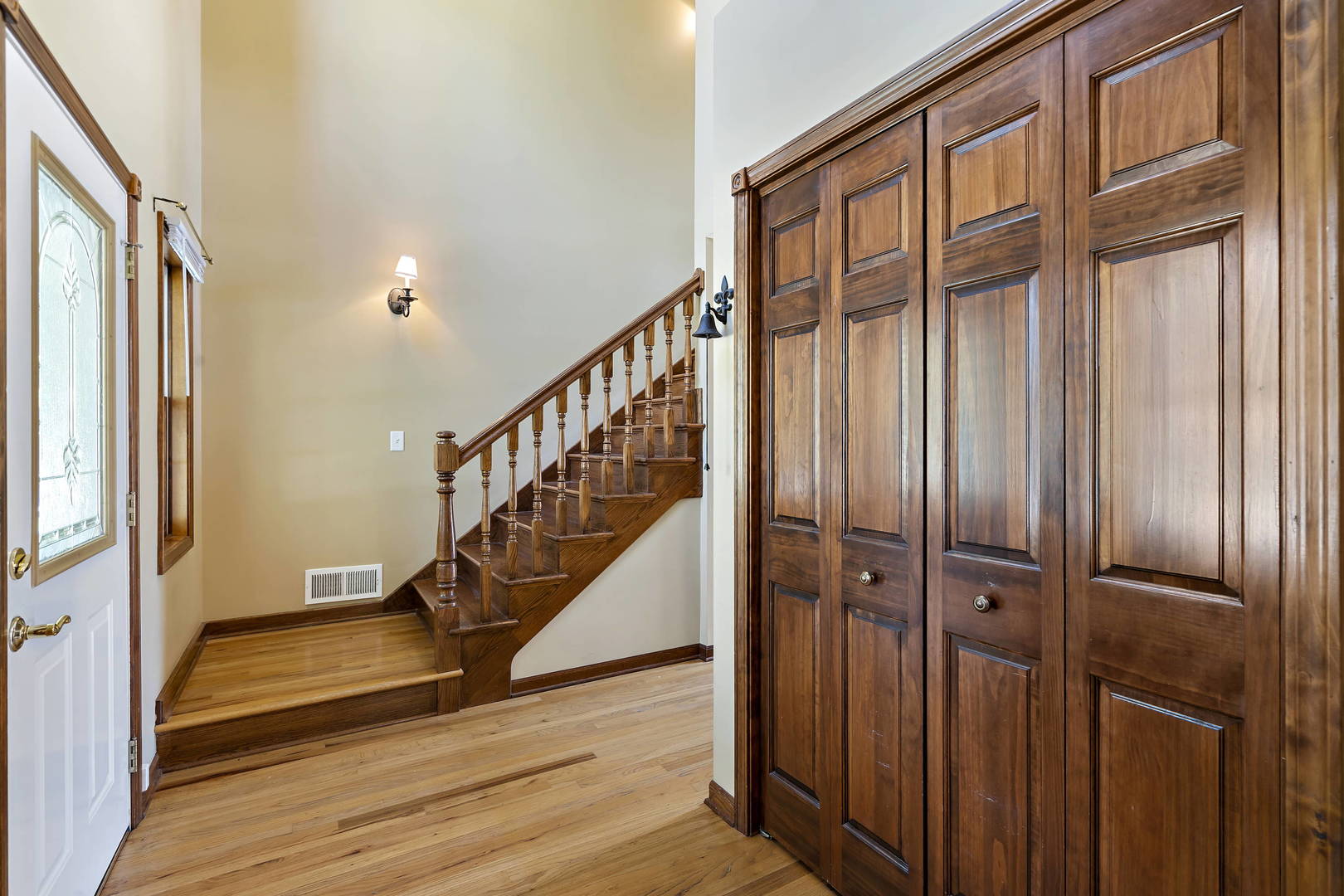 23501 West McClintock Road Channahon, IL 60410 - Photo 3 of 19 a view of staircase with wooden floor and windows