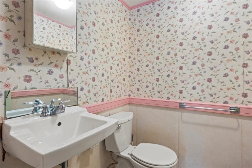 600 High Street Westwood, MA 02090 - Photo 14 of 27 a bathroom with a sink a toilet and mirror