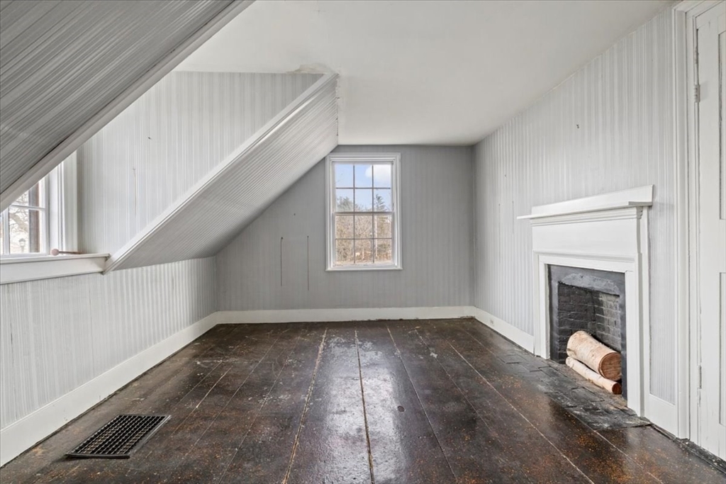 600 High Street Westwood, MA 02090 - Photo 21 of 27 a view of empty room with wooden floor and fireplace