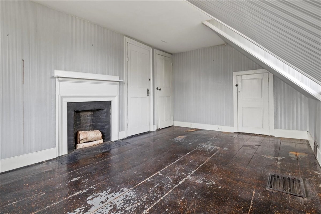 600 High Street Westwood, MA 02090 - Photo 22 of 27 a view of an empty room with a fireplace and a window