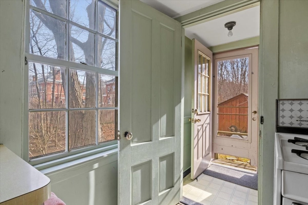 600 High Street Westwood, MA 02090 - Photo 10 of 27 a view of an entryway with a floor to ceiling window and wooden floor