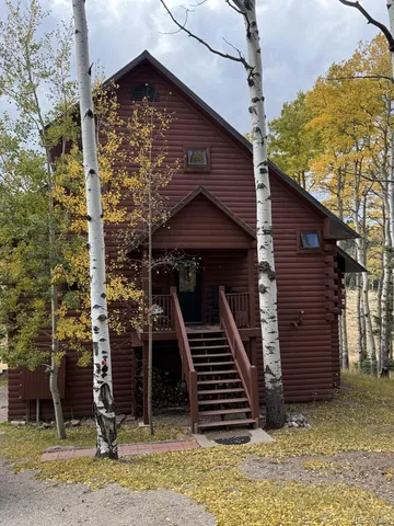a front view of a house with stairs