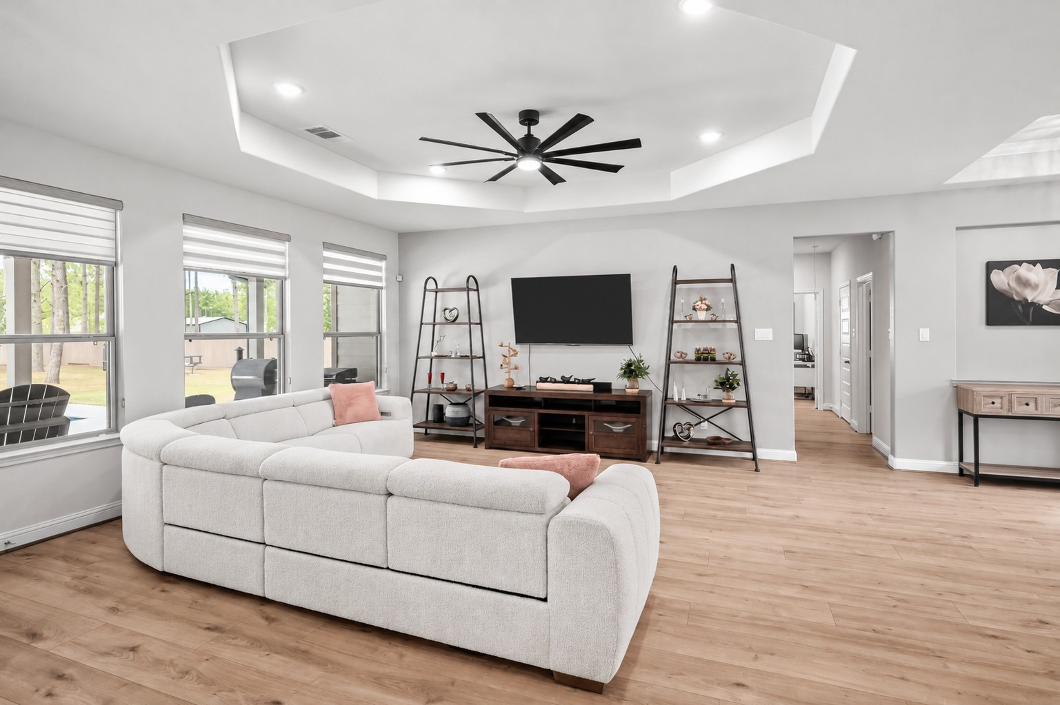 13419 Maverick Trail Road Conroe, TX 77303 - Photo 7 of 48 The family room with tray ceiling and an oversized modern ceiling fan.