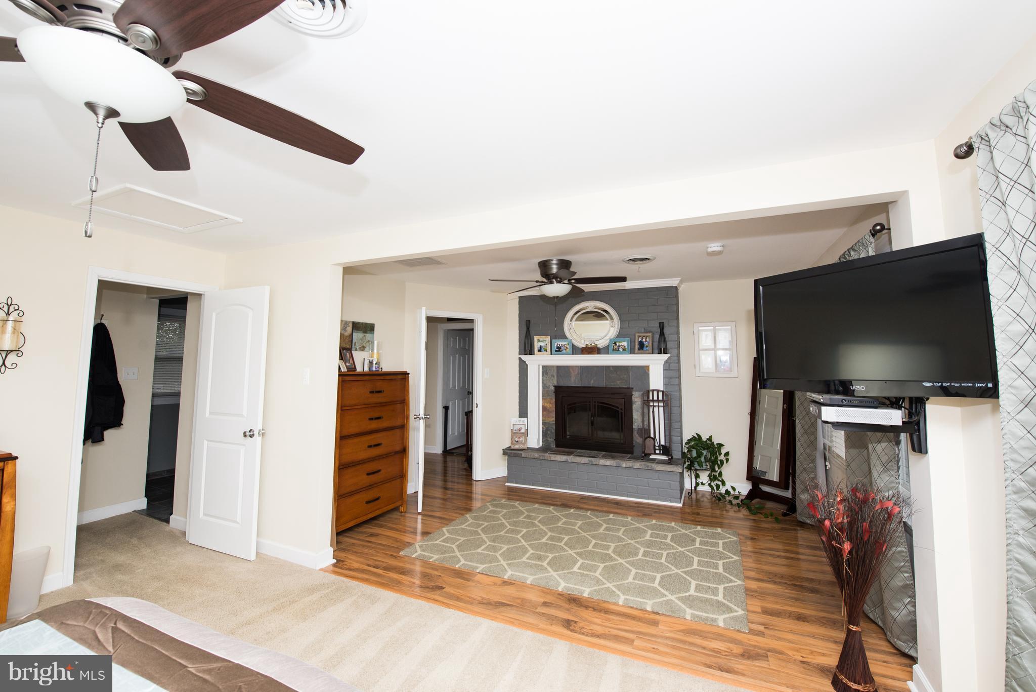 604 Bryan Point Road Accokeek, MD 20607 - Photo 12 of 29 a living room with furniture and a flat screen tv