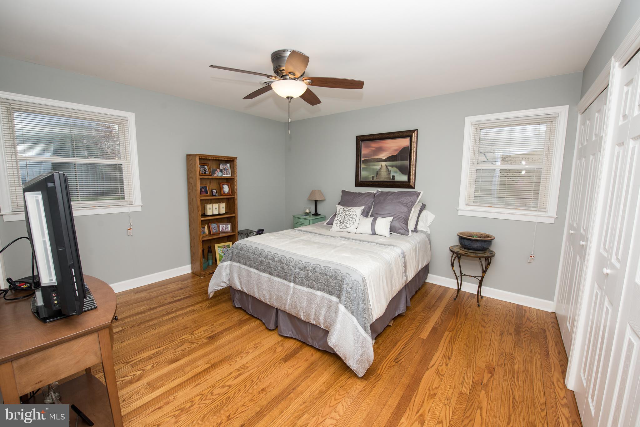 604 Bryan Point Road Accokeek, MD 20607 - Photo 15 of 29 a bedroom with a bed and a flat screen tv