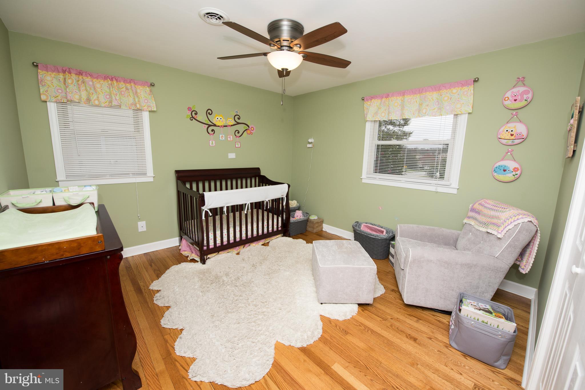 604 Bryan Point Road Accokeek, MD 20607 - Photo 17 of 29 a bedroom with a bed and a chandelier