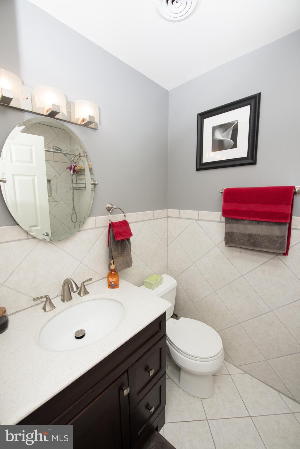 604 Bryan Point Road Accokeek, MD 20607 - Photo 19 of 29 a bathroom with a sink vanity mirror and toilet