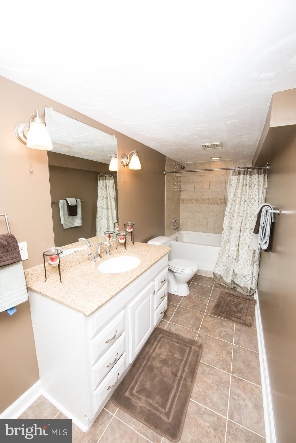 604 Bryan Point Road Accokeek, MD 20607 - Photo 21 of 29 a bathroom with a sink and a mirror