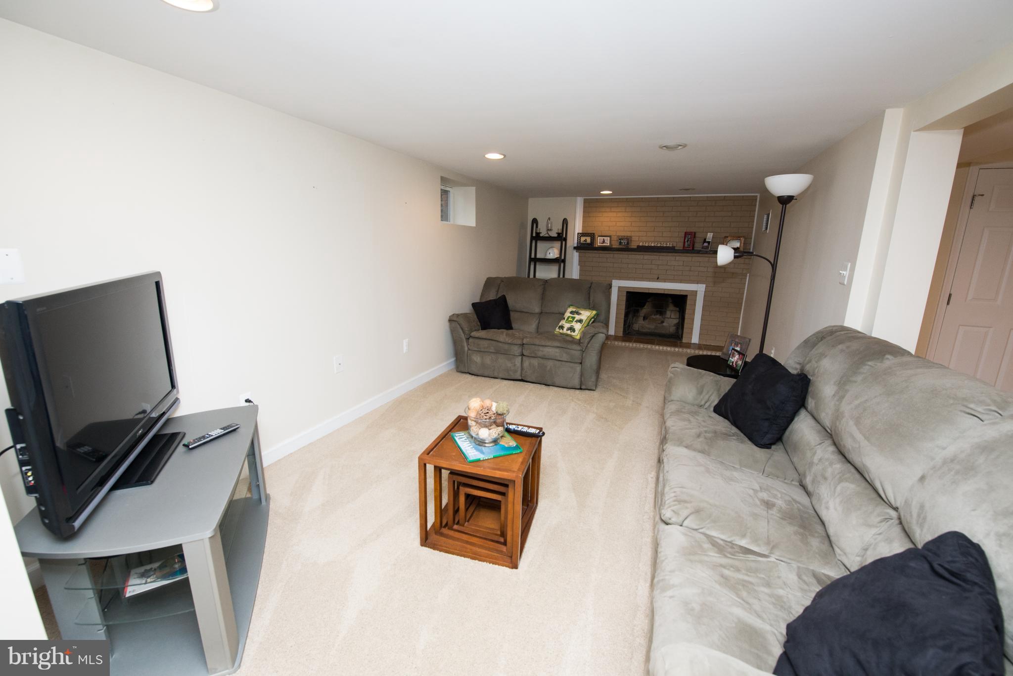 604 Bryan Point Road Accokeek, MD 20607 - Photo 23 of 29 a room with furniture and a flat screen tv