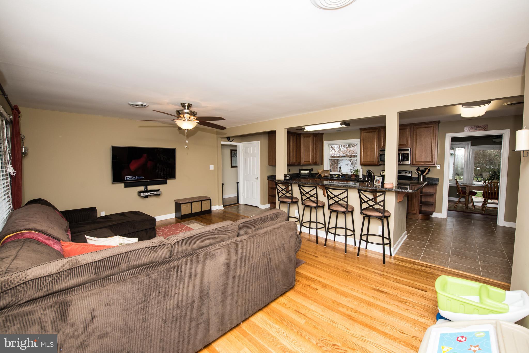 604 Bryan Point Road Accokeek, MD 20607 - Photo 8 of 29 a living room with furniture and a flat screen tv