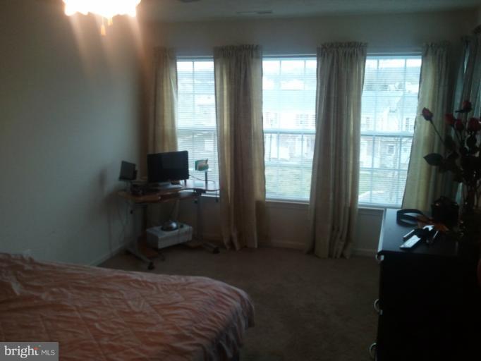 9902 Decatur Road Middle River, MD 21220 - Photo 11 of 18 a bedroom with a bed and a window