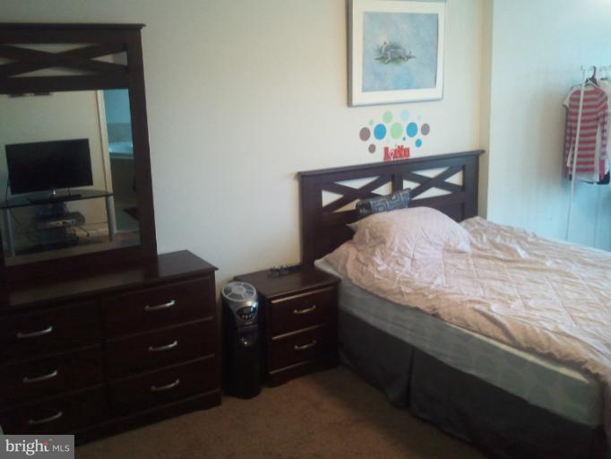 9902 Decatur Road Middle River, MD 21220 - Photo 12 of 18 a bedroom with a bed and a television