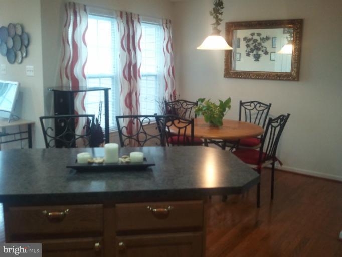 9902 Decatur Road Middle River, MD 21220 - Photo 4 of 18 a view of a dining room with furniture and window