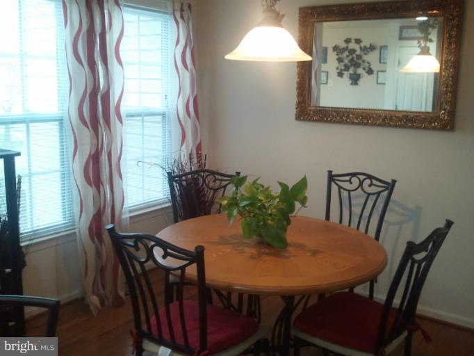 9902 Decatur Road Middle River, MD 21220 - Photo 5 of 18 a view of a dining room with furniture and window