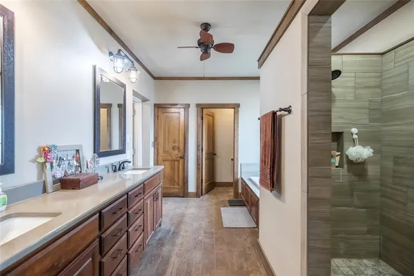 a bathroom with bathtub and window