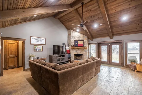 a living room with fireplace furniture and a flat screen tv