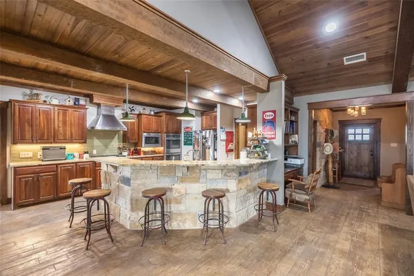 a kitchen with a table and chairs in it