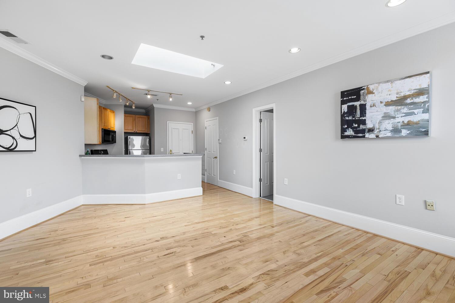 20 Logan Circle Northwest, Unit 32 Washington, DC 20005 - Photo 18 of 23 a view of a kitchen with furniture and wooden floor