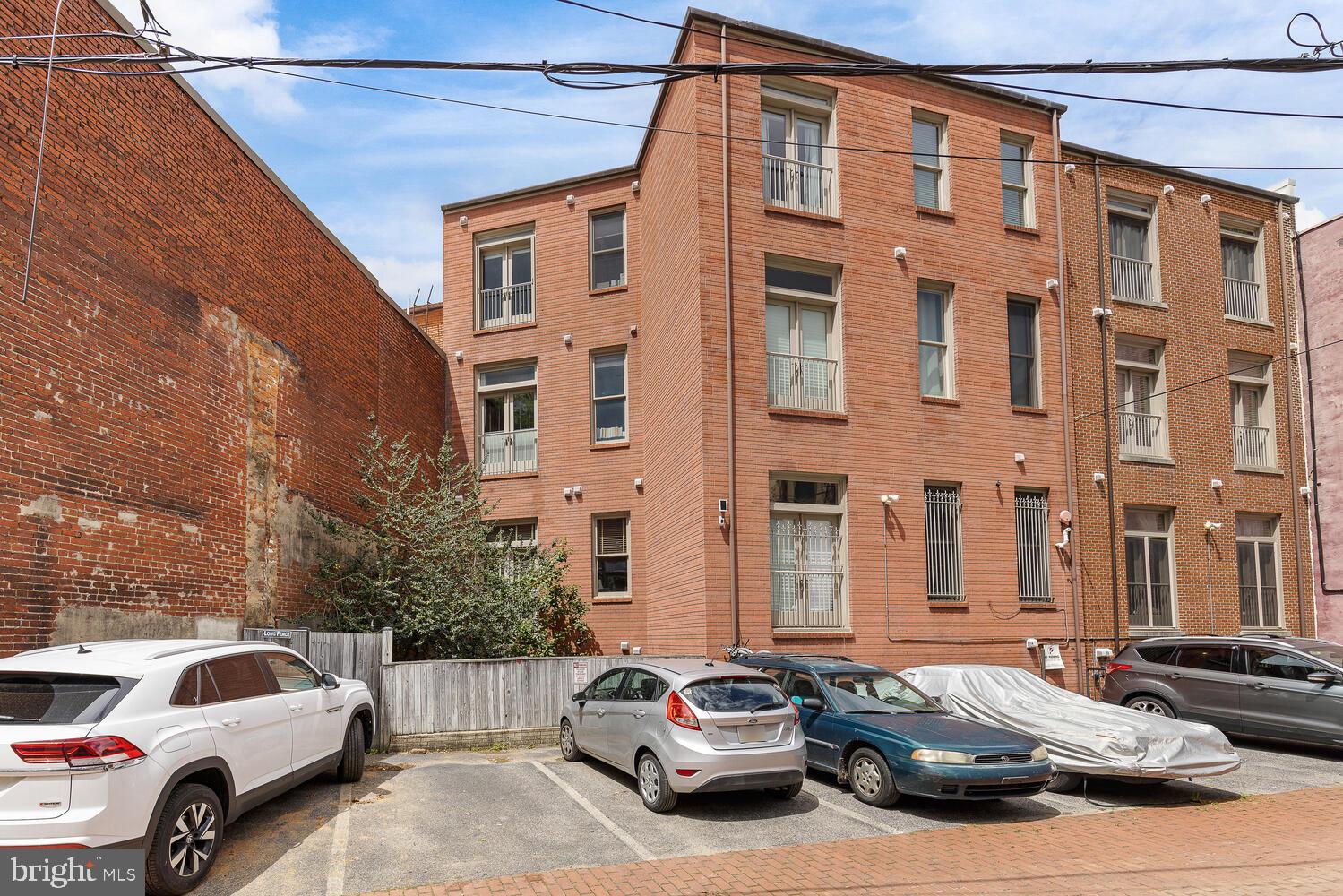 20 Logan Circle Northwest, Unit 32 Washington, DC 20005 - Photo 4 of 23 a view of a cars park in front of a building