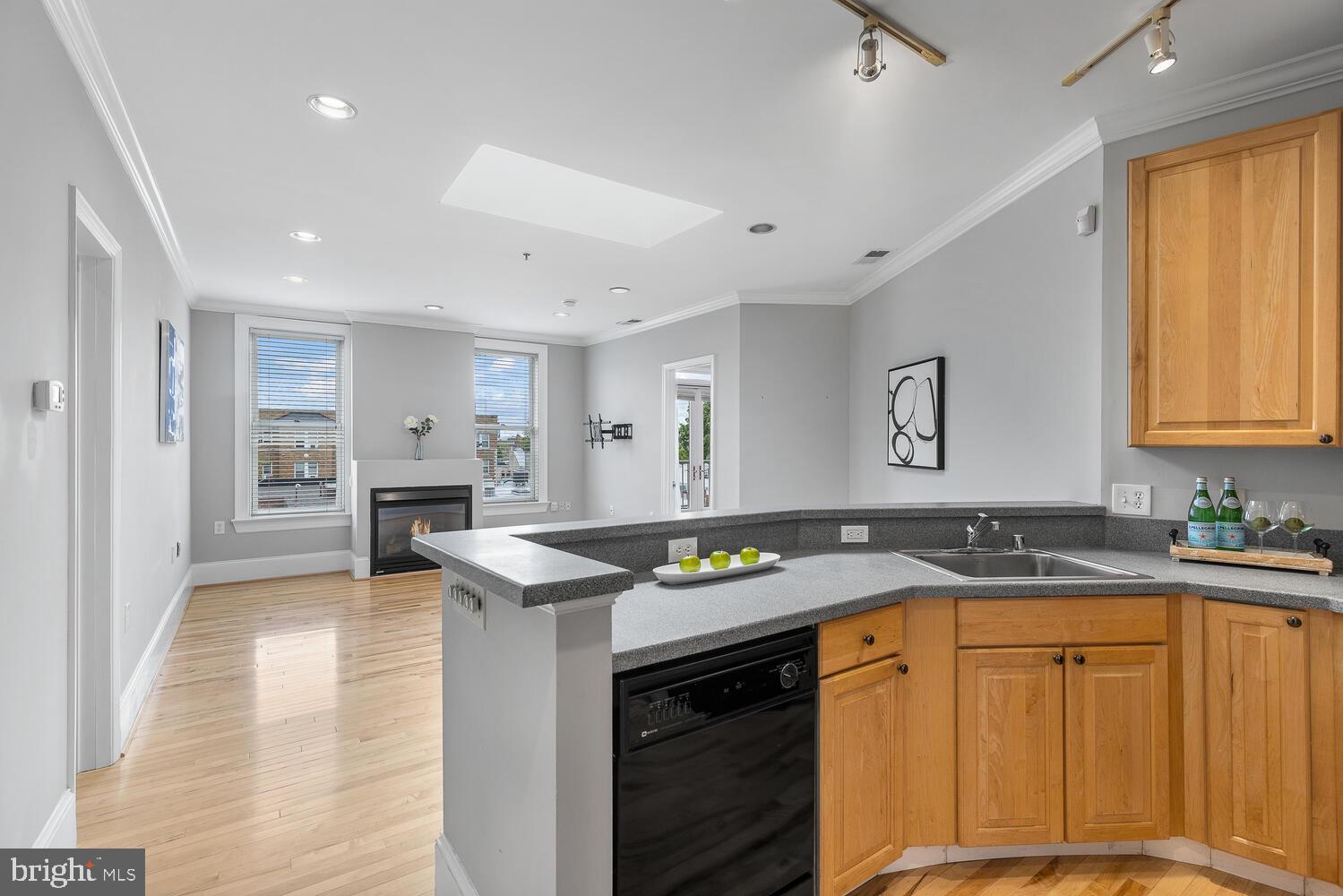 20 Logan Circle Northwest, Unit 32 Washington, DC 20005 - Photo 8 of 23 a kitchen that has a sink a stove counter top space and cabinets