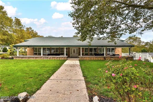 front view of a house with a yard