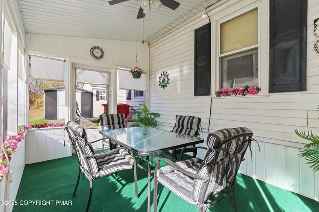 a view of a patio with table and chairs and potted plants