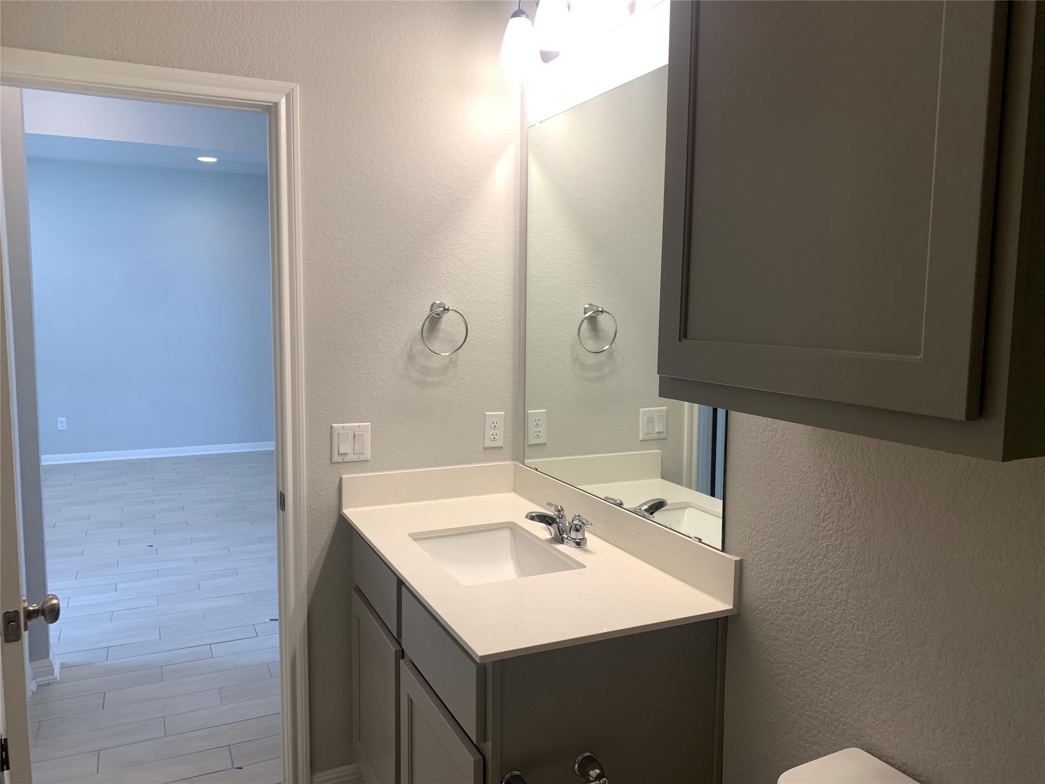 2948 Sage Ranch Drive Leander, TX 78641 - Photo 7 of 28 A well-appointed bathroom vanity with a spacious counter and cabinet storage.