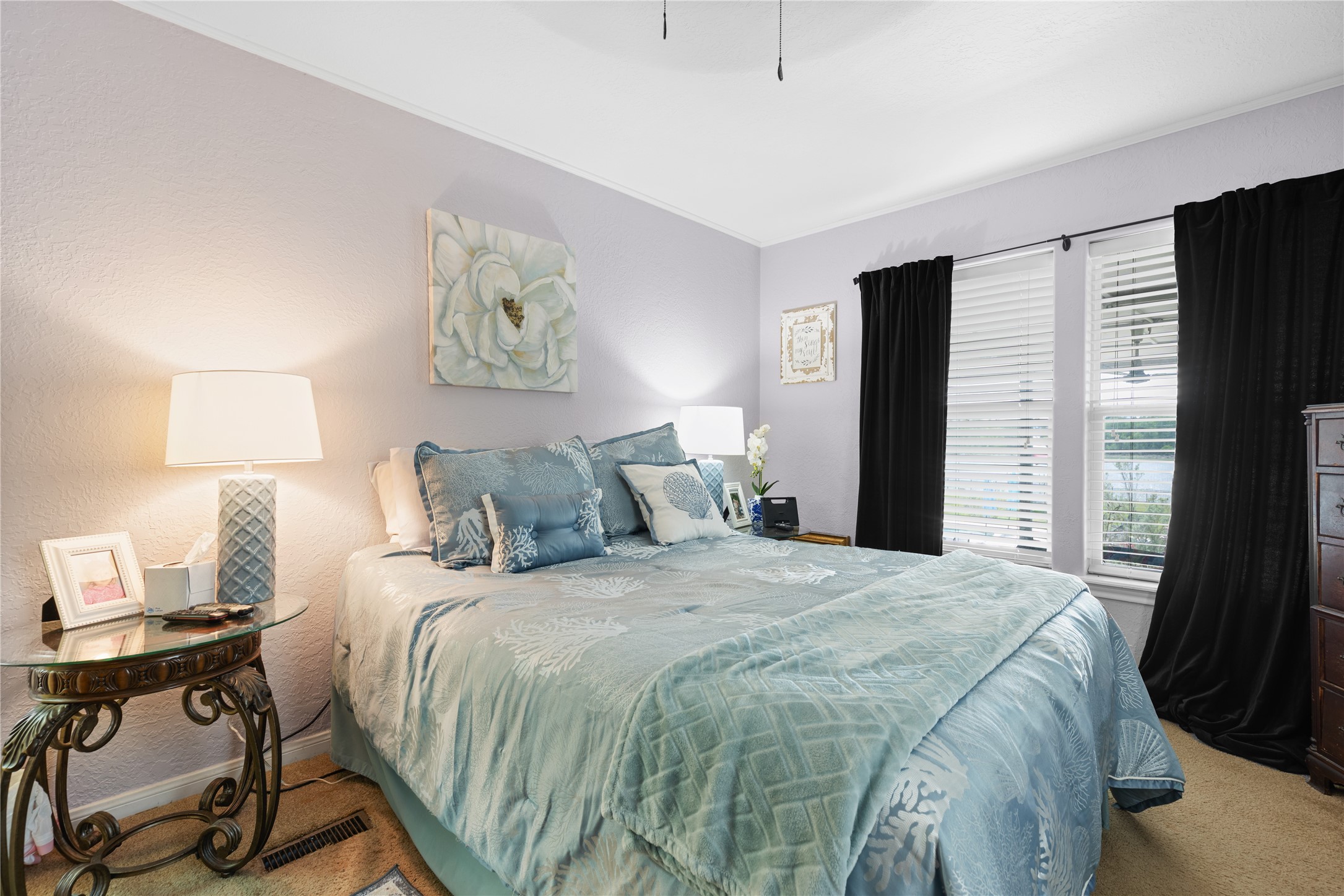 174 Lake Front Drive Trinity, TX 75862 - Photo 26 of 44 a bedroom with a bed and wooden floor