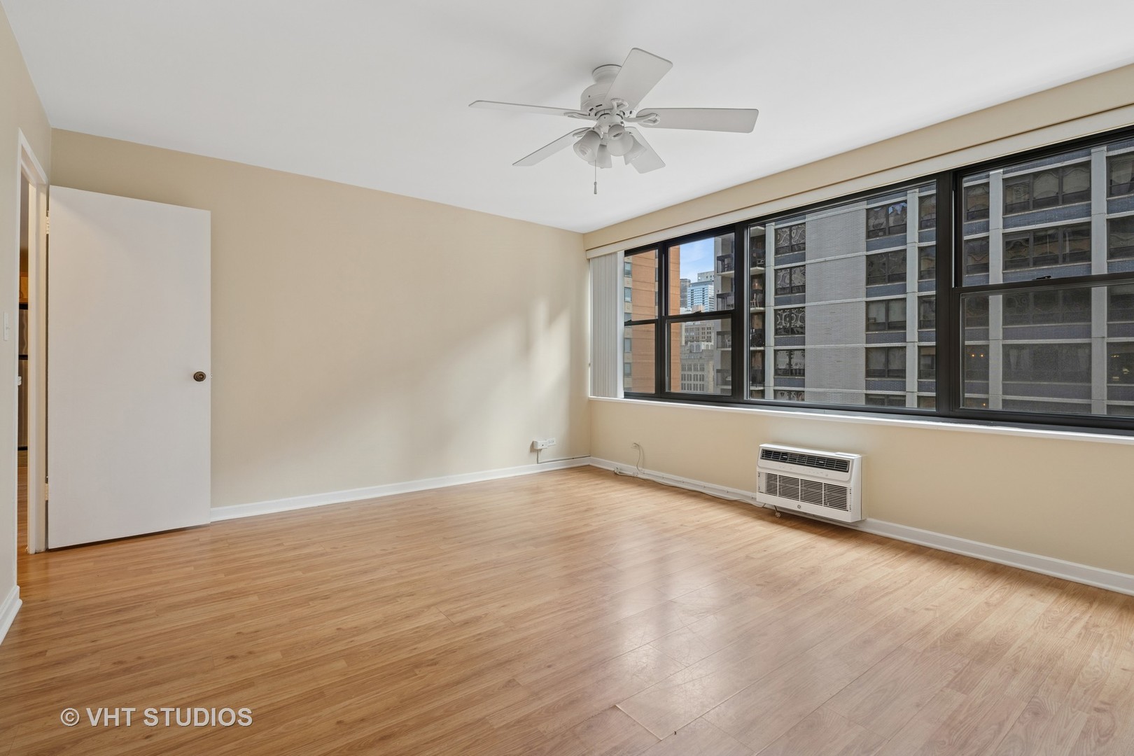 850 North Dewitt Place, Unit 11D Chicago, IL 60611 - Photo 7 of 15 a view of an empty room with a window